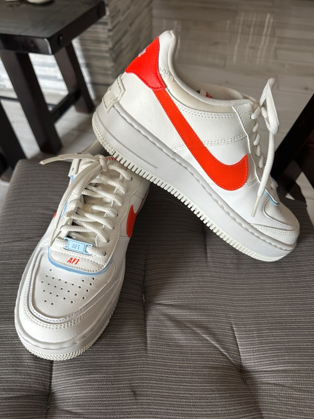 Nike Women's White Sneakers with Orange Swoosh
